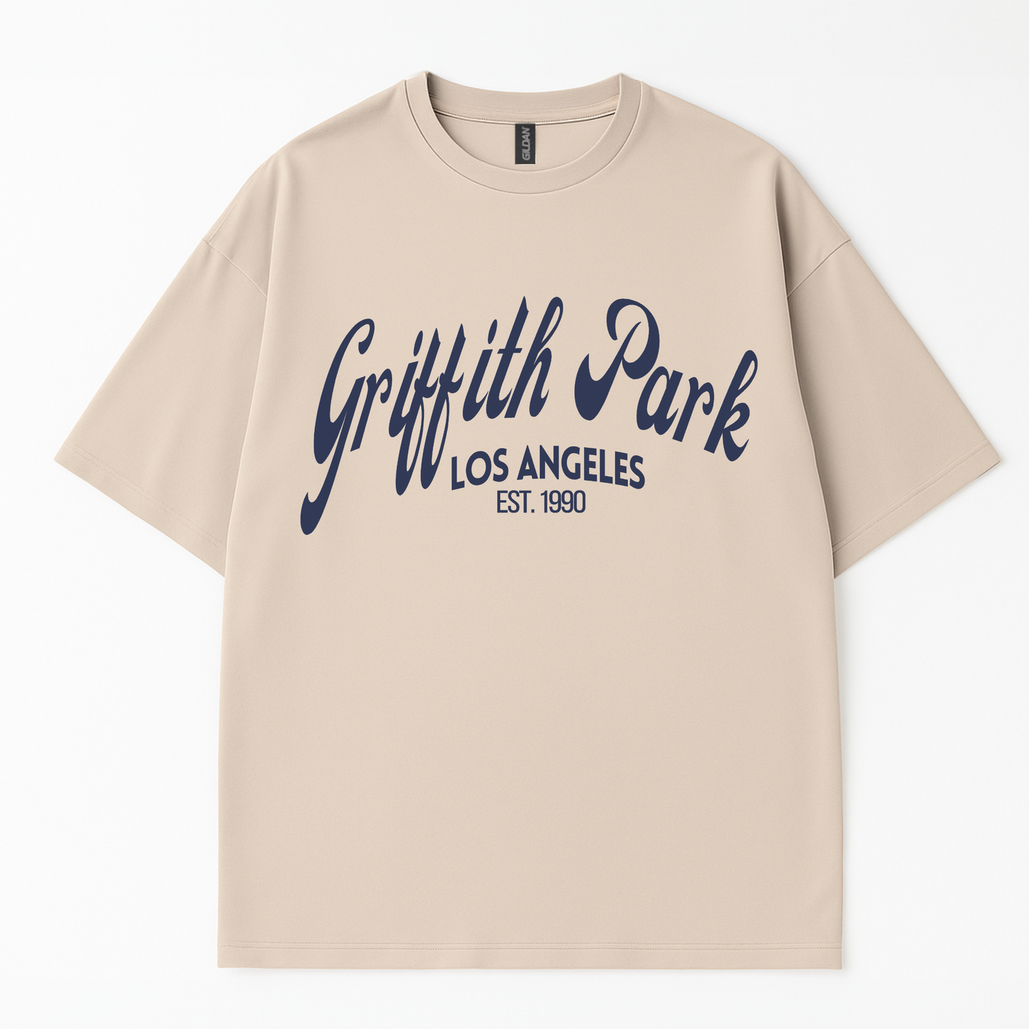 Close-up of “Griffith Park Los Angeles EST. 1990” white text printed on soft charcoal cotton t-shirt by Côte Crew.