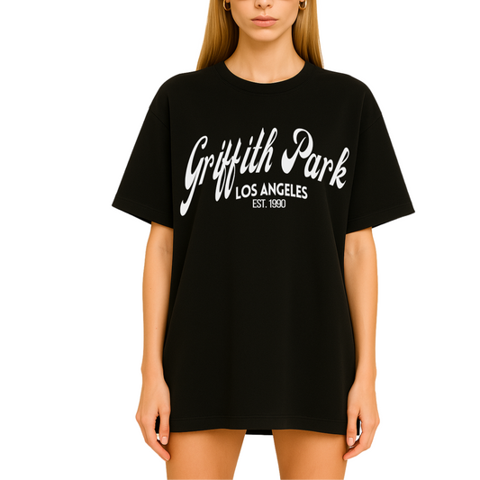 Model wearing Côte Crew’s Griffith Park graphic t-shirt for women, showcasing minimalist front design in white lettering