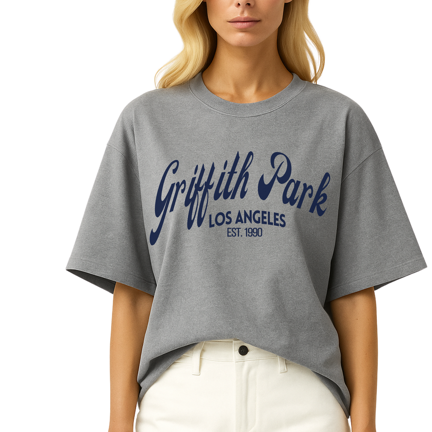 Model wearing Côte Crew’s Griffith Park graphic t-shirt , showcasing minimalist front design in blue lettering.