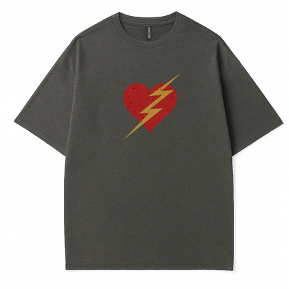 Woman trendy t-shirt with a bold red heart and yellow lightning bolt graphic. Retro-inspired pop art design 