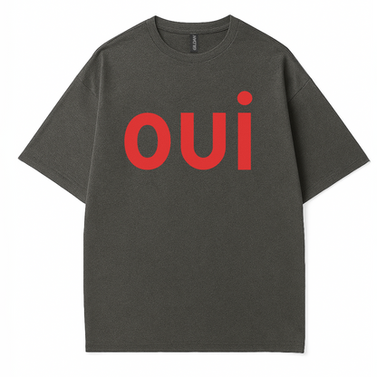  Côte Crew’s “oui” t-shirt hanging for display, showcasing bold statement design and clean cotton texture
