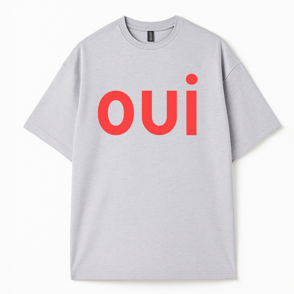 Lifestyle shot of Côte Crew’s “oui” tee paired with casual streetwear for a modern, French minimalist outfit.